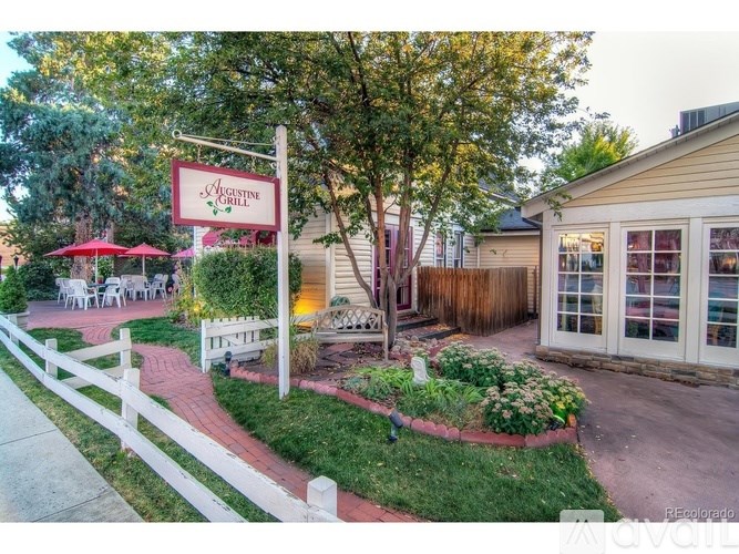 A sign that says "Aristotle" is in front of a building.