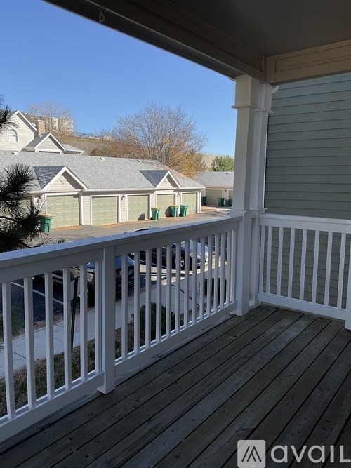 A window with brown curtains and a white curtain behind it.