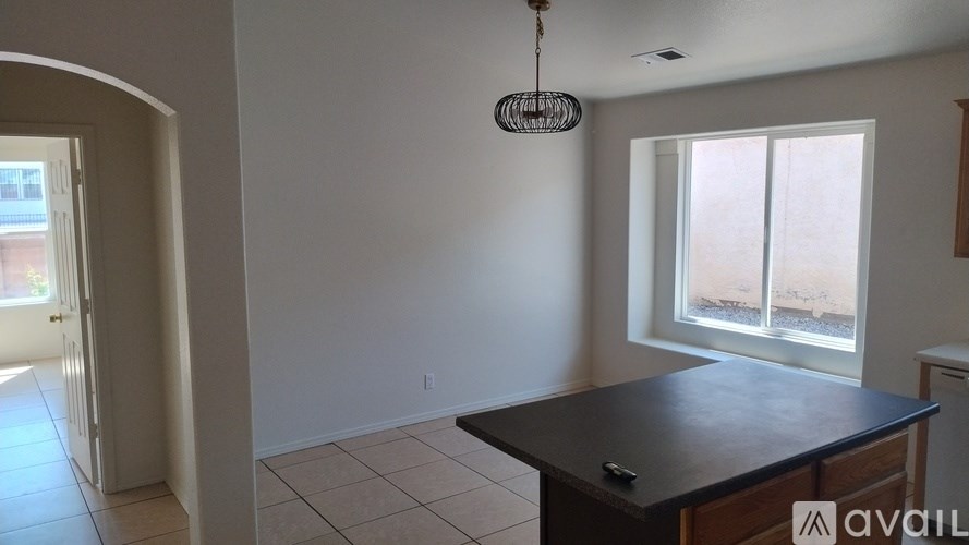 A room with a table and a window.