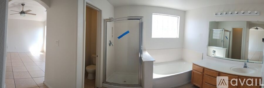 A bathroom with a walk-in shower and a toilet.