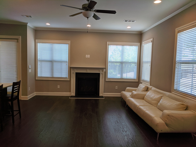 A living room with a fireplace and a couch.