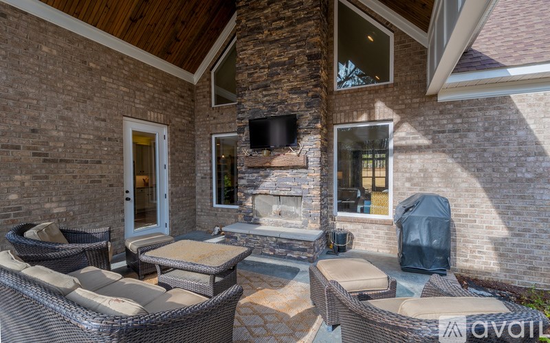 A patio area with a fireplace and seating area.