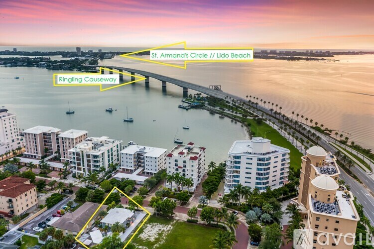 A cityscape with a bridge and a body of water.