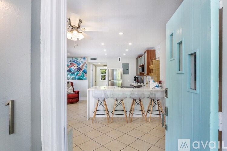A dining area with a table set for four.