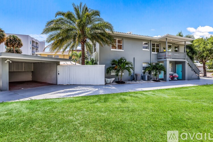 A house with a garage and a balcony is for sale.
