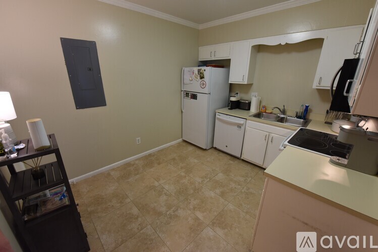 A kitchen with a table and chairs in it.