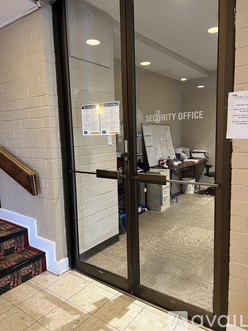 A glass door with a sign that says "Security Office" on it.