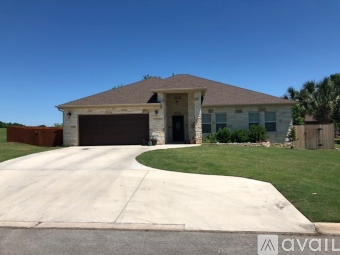 A house with a driveway in front of it.