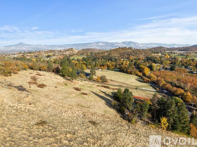 A living room with wooden floors and furniture.