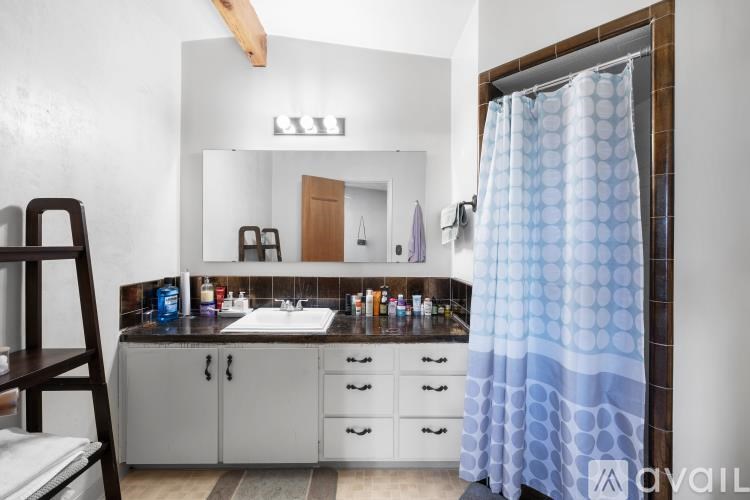 A kitchen with wooden cabinets and a white refrigerator.