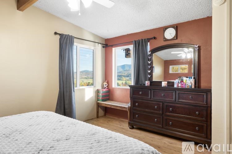 A kitchen with wooden cabinets and a white refrigerator.