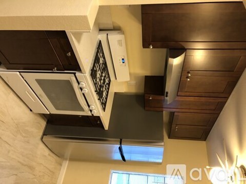 A kitchen with a stove top oven and a microwave.