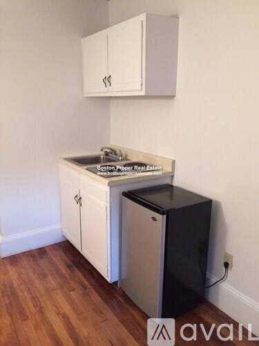 A kitchen with a sink and a dishwasher.