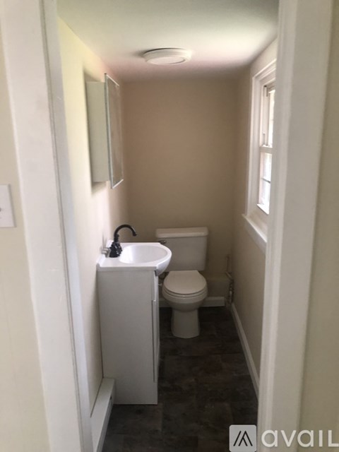 A small bathroom with a toilet and sink.