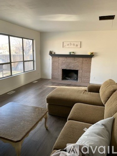 A living room with a fireplace and a couch.
