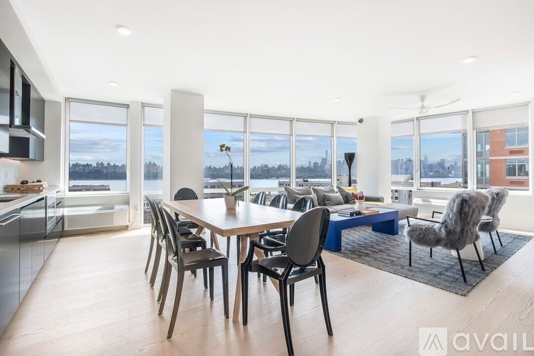 A modern kitchen with a dining table and chairs.