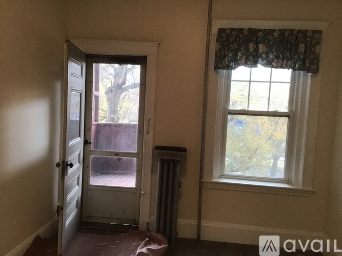 A room with a door and a window.