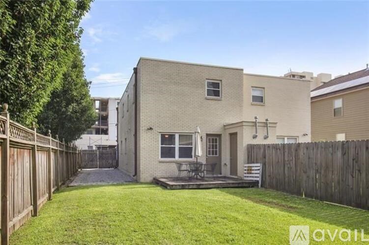 A house with a backyard and a patio.
