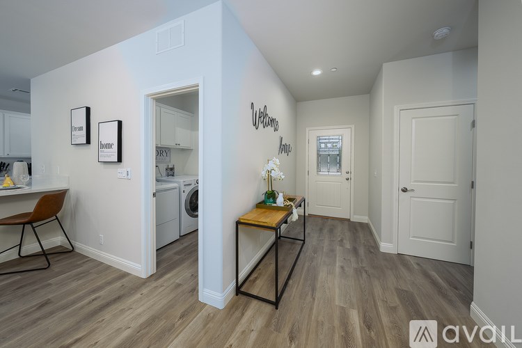 A room with a washer and dryer in it.