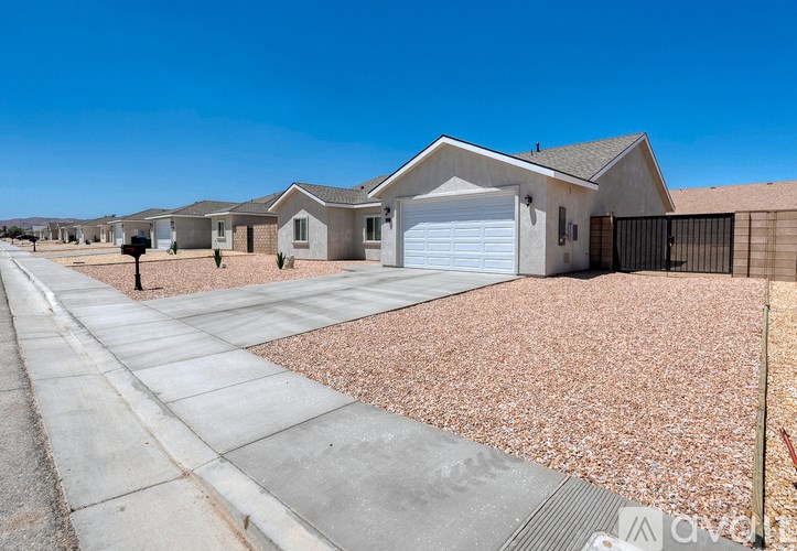A row of houses with a clear blue sky above them.