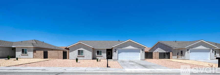 A row of houses with garages in front.