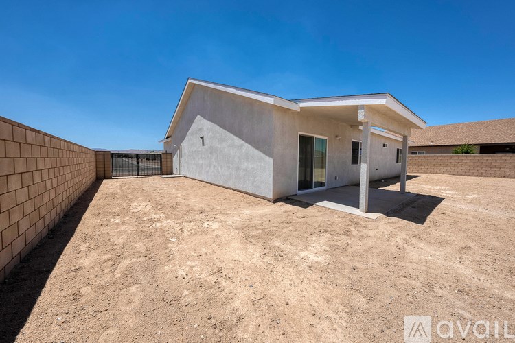 A modern house with a flat roof and a concrete exterior is numbered 1 and is available for purchase.