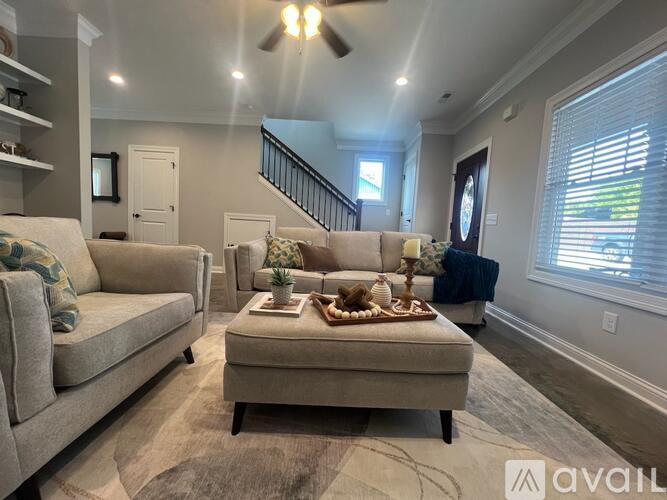 A floor plan of a two-story house with three bedrooms and a living area.