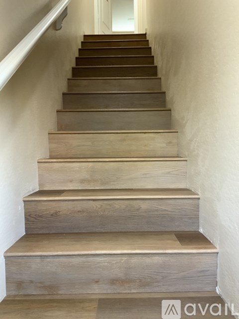 A set of wooden stairs leading upwards.