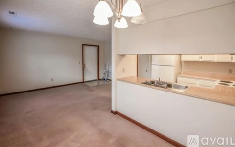 A kitchen area with a sink and a countertop.