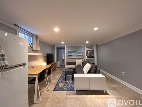 A modern kitchen with a dining table and chairs.