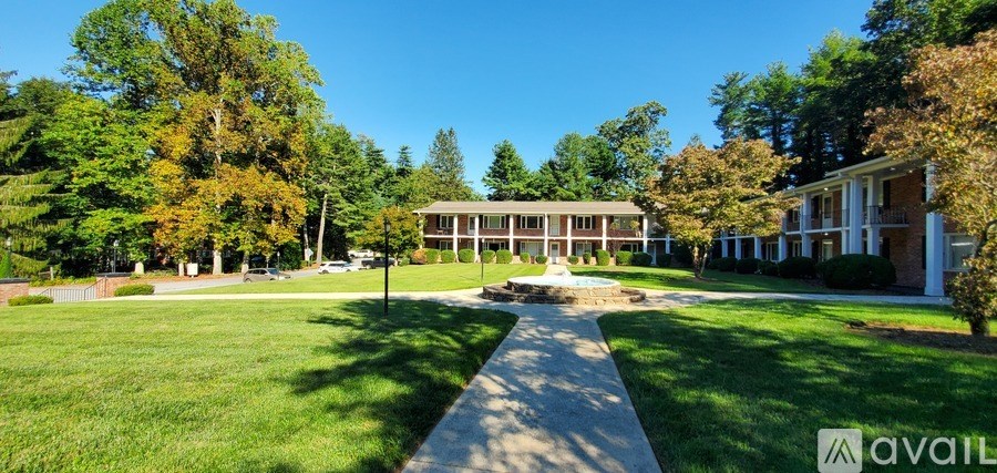 A large building with a fountain in front of it.