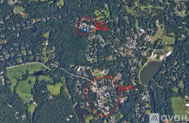 A satellite image shows a large area with a red circle highlighting a specific section.