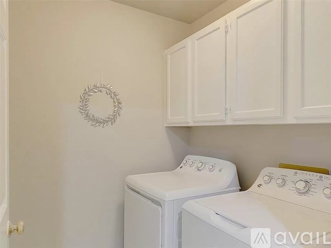 A laundry room with a washer and dryer.