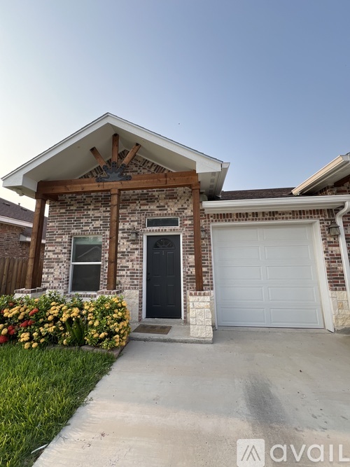 A house with a garage and a driveway.