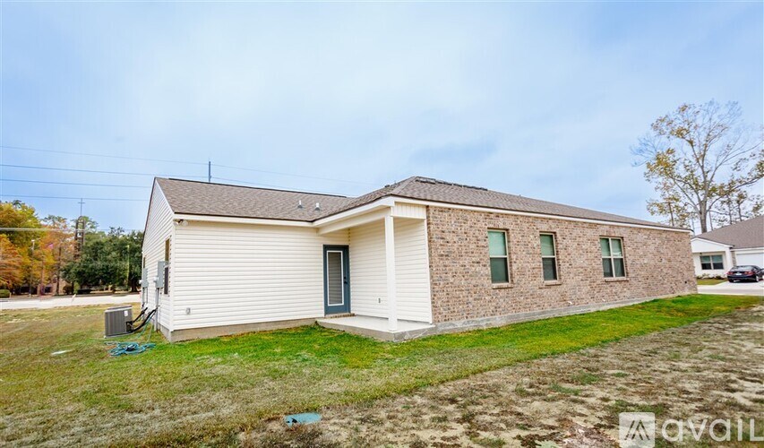 A two-story house with a garage on the left side.