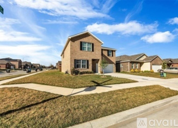 A house with a lawn in front is for sale.
