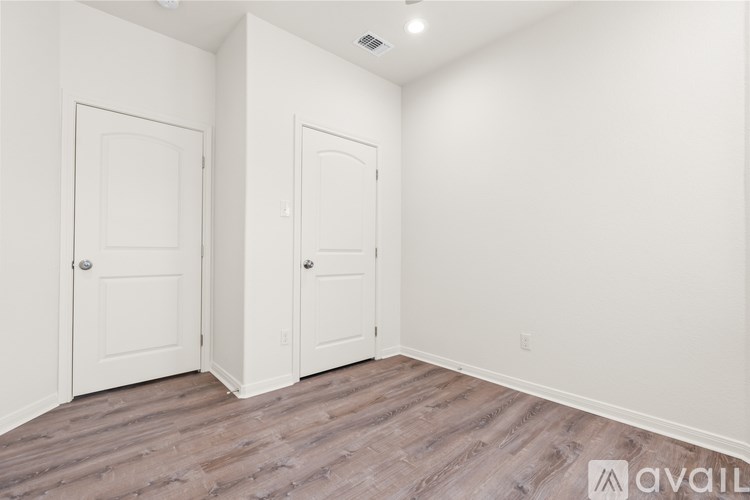 A kitchen with a granite countertop and stainless steel appliances.