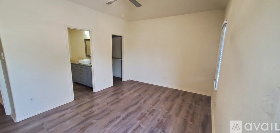 A room with a bed and a dresser is available for rent.