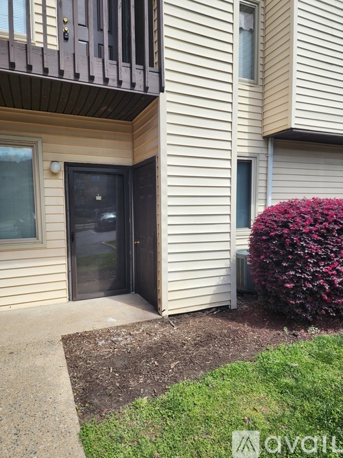 A building with a black door and a window.