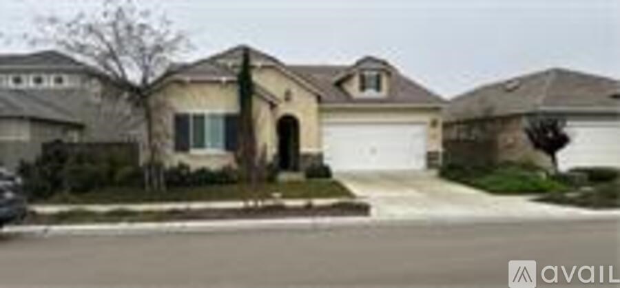 A house with a driveway in front of it.