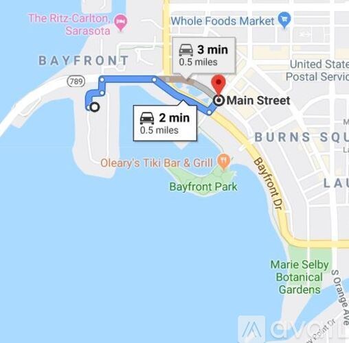 A map shows a route from one location to another, with a Whole Foods Market and a Ritz-Carlton hotel in Sarasota.