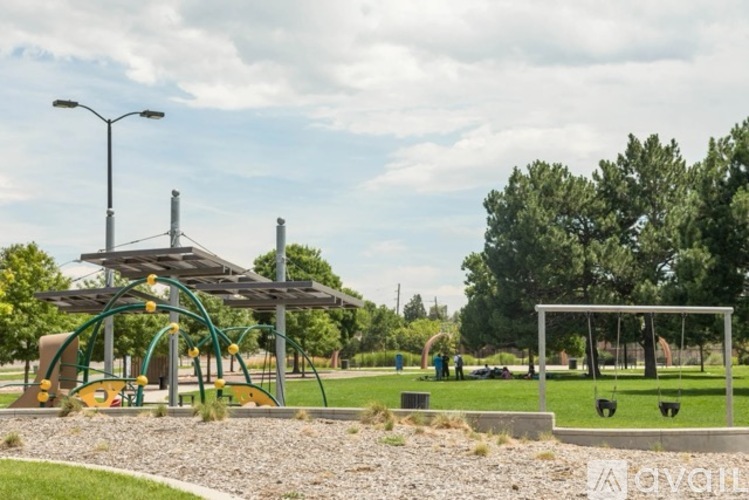 A playground with a swing set and a slide.
