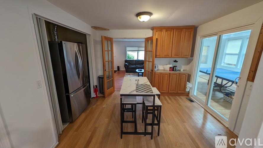 A kitchen with wooden cabinets and a white countertop.