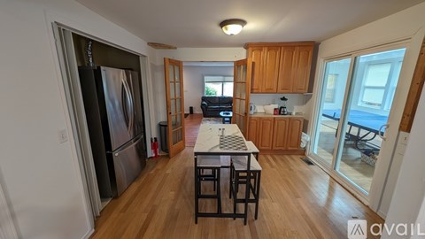 A kitchen with wooden cabinets and a white countertop.
