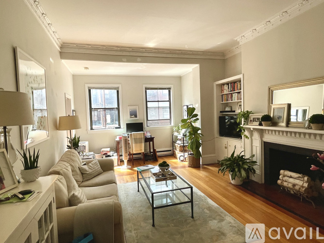 A living room with a fireplace and a couch.