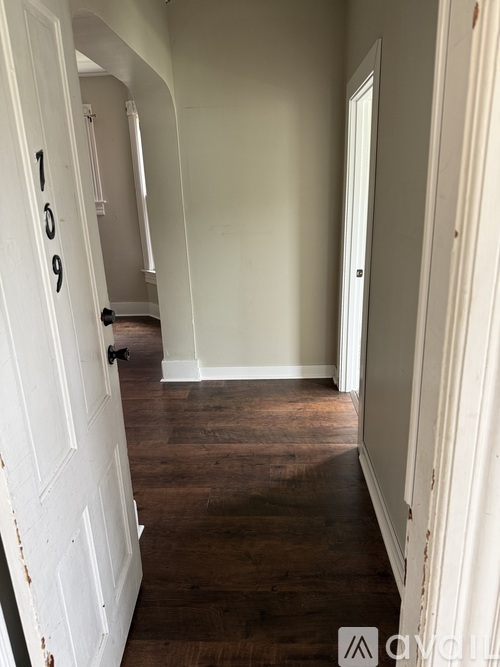 A hallway with a door numbered 109.