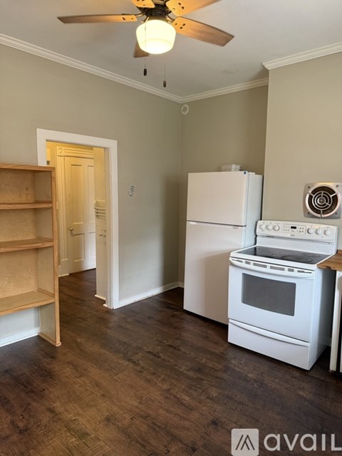 A kitchen with a white refrigerator and a white oven.