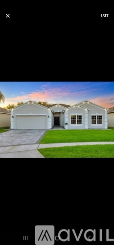 A house with a garage is displayed in the image.
