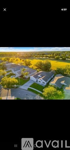 A bird's eye view of a residential area with houses and trees.
