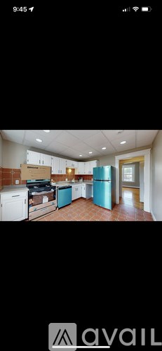 A kitchen with a dishwasher, oven, and refrigerator.